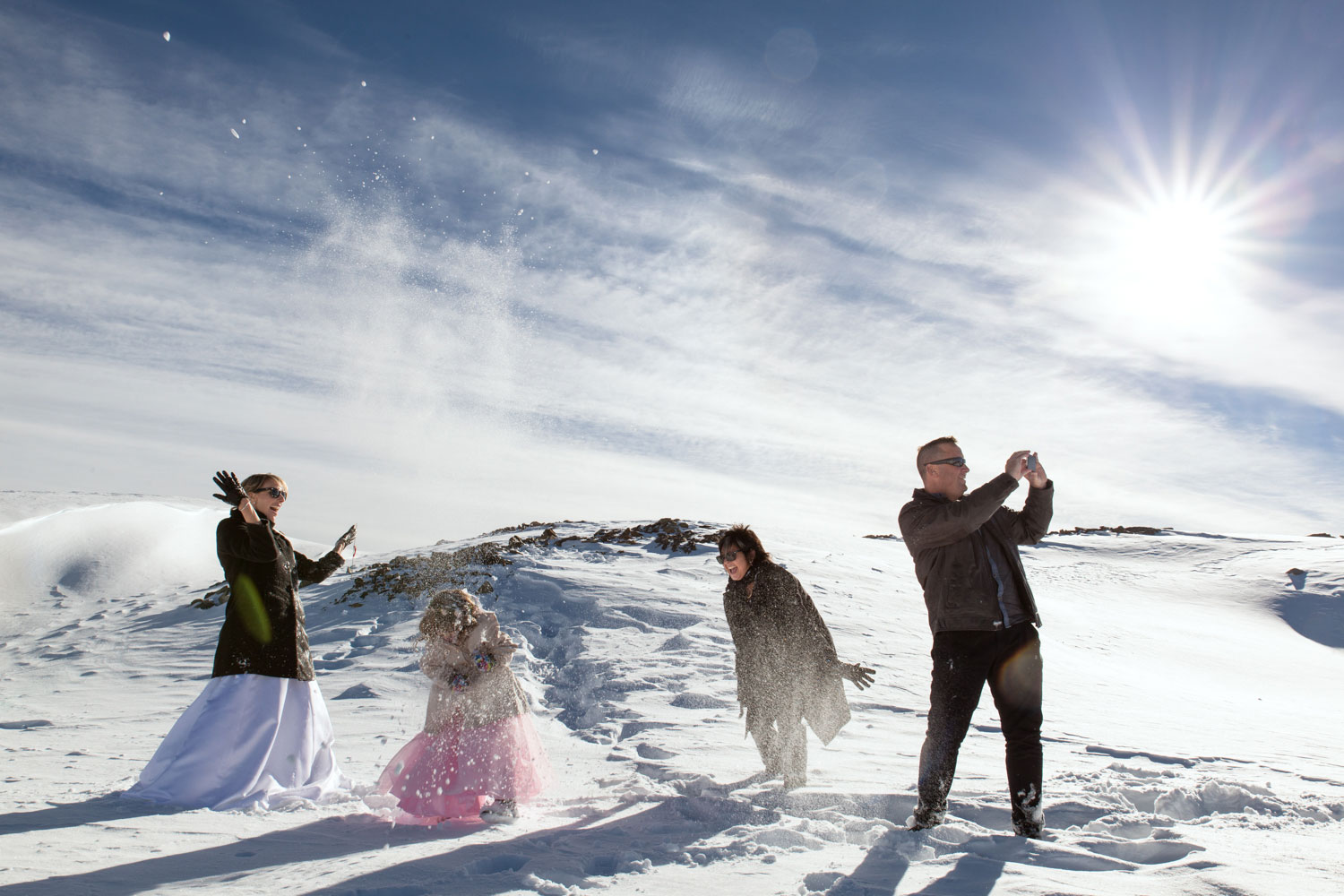 destination wedding having fun in snow