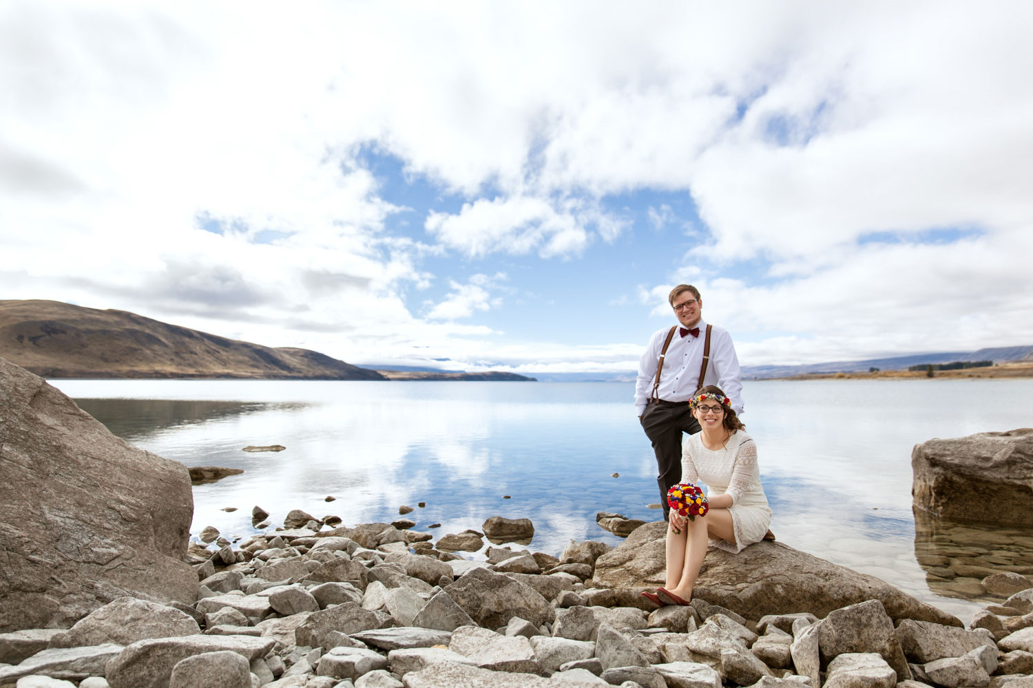 new zealand wedding couple and clouds