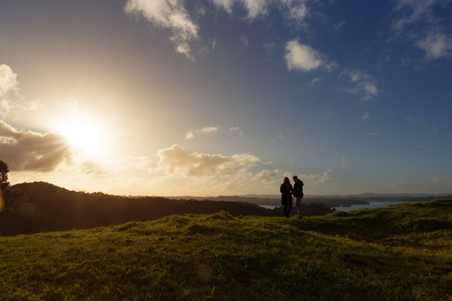 auckland engagement photo couple looking at sunset