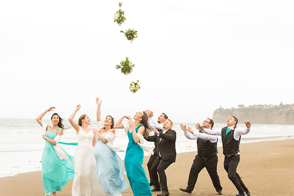 auckland wedding bridal party throwing bouquet