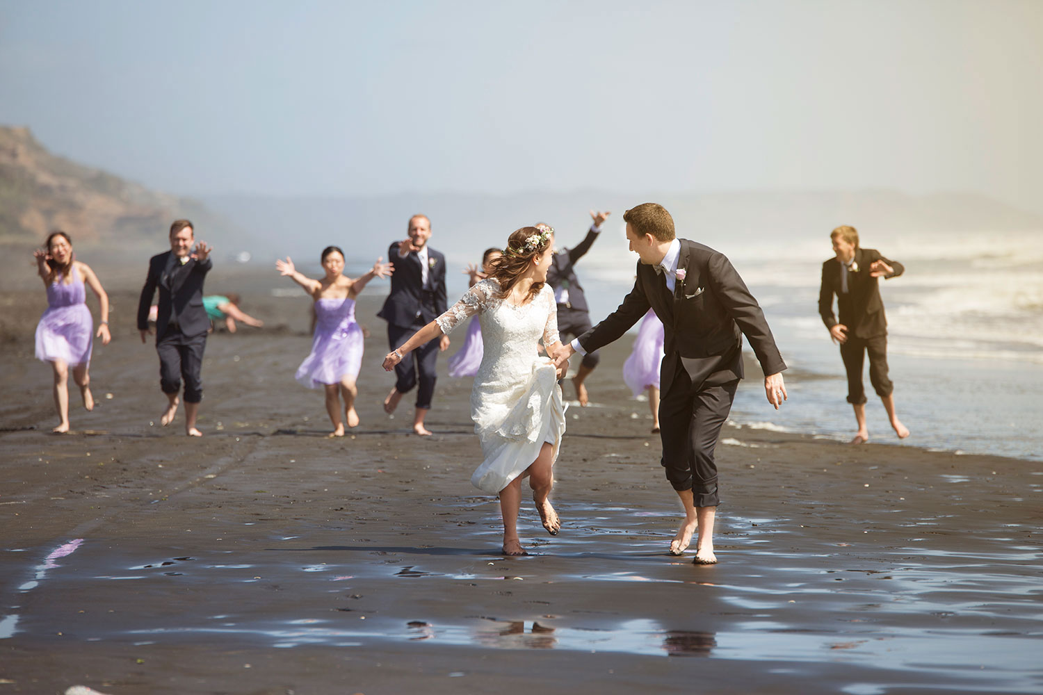 auckland castaways resort wedding bridal party chasing couple