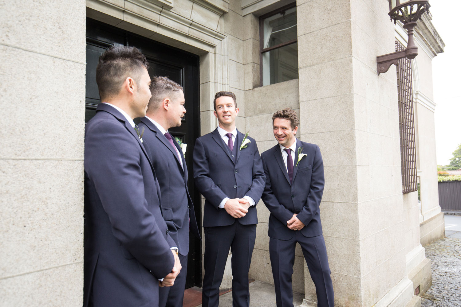 groomsmen talking among themselves