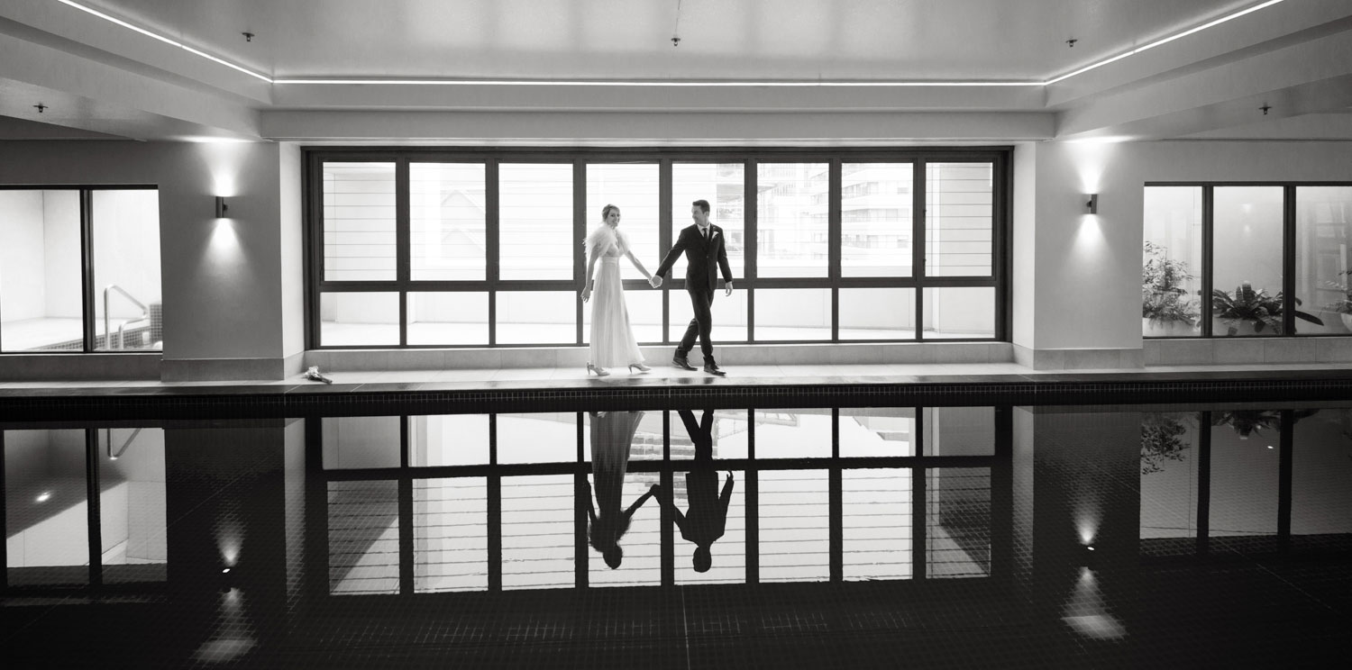 couple walking across urban photos