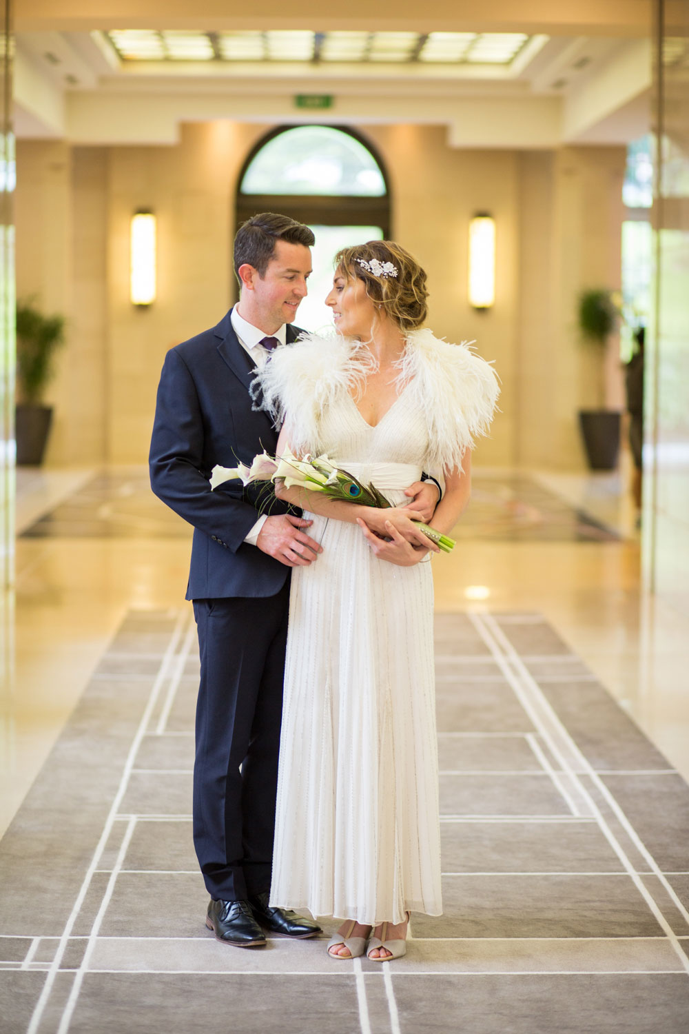 bride and groom posing at magistrates auckland