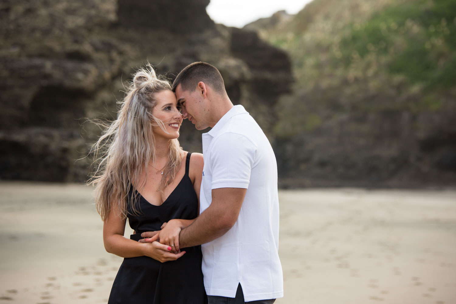 couple embracing beach