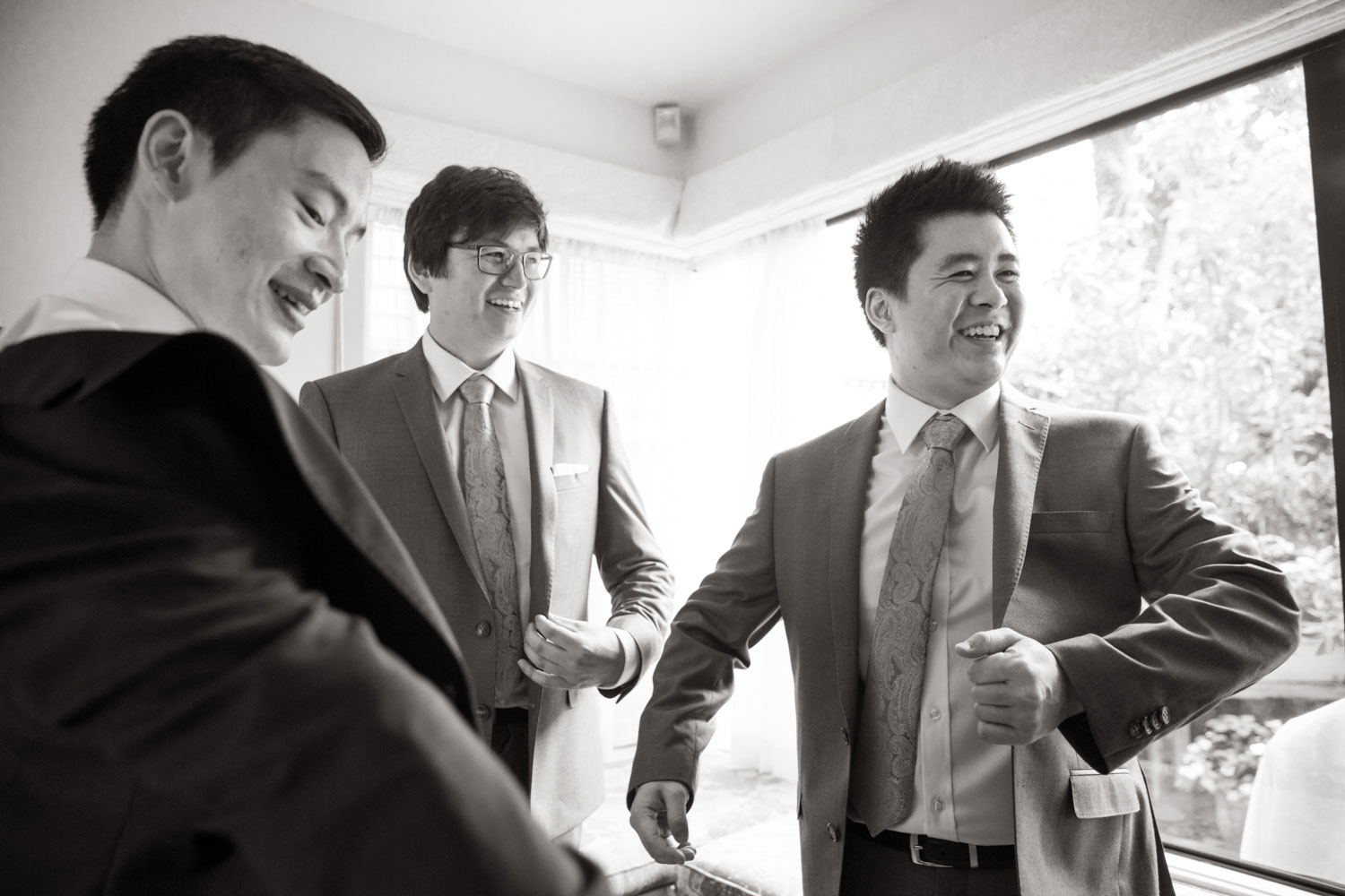 groomsmen sharing a laugh