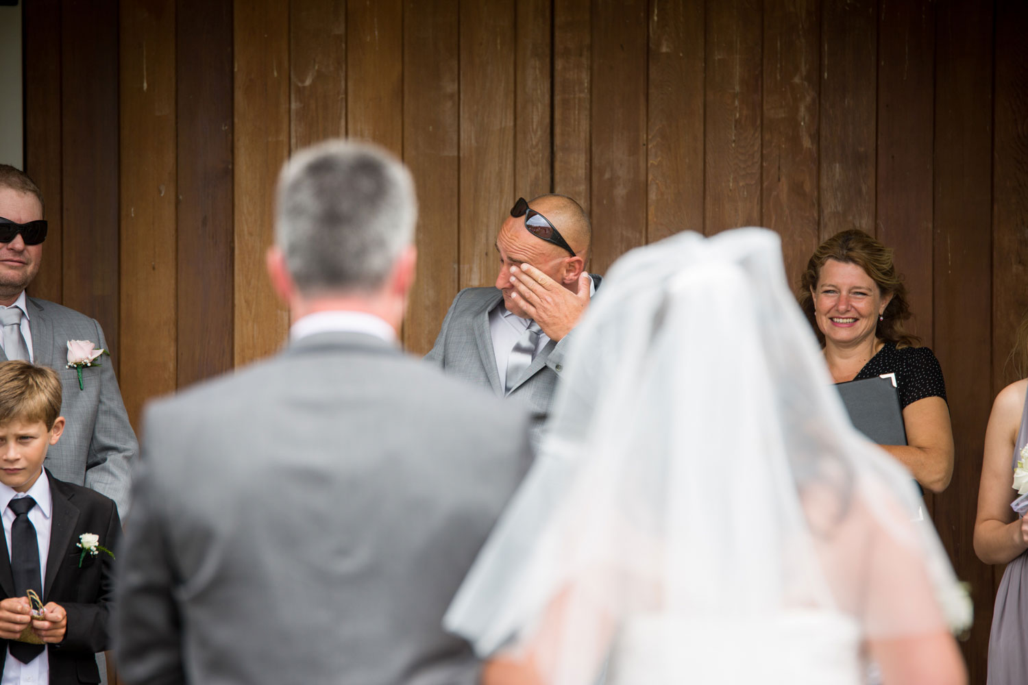 groom reacts to bride walking down the aisle