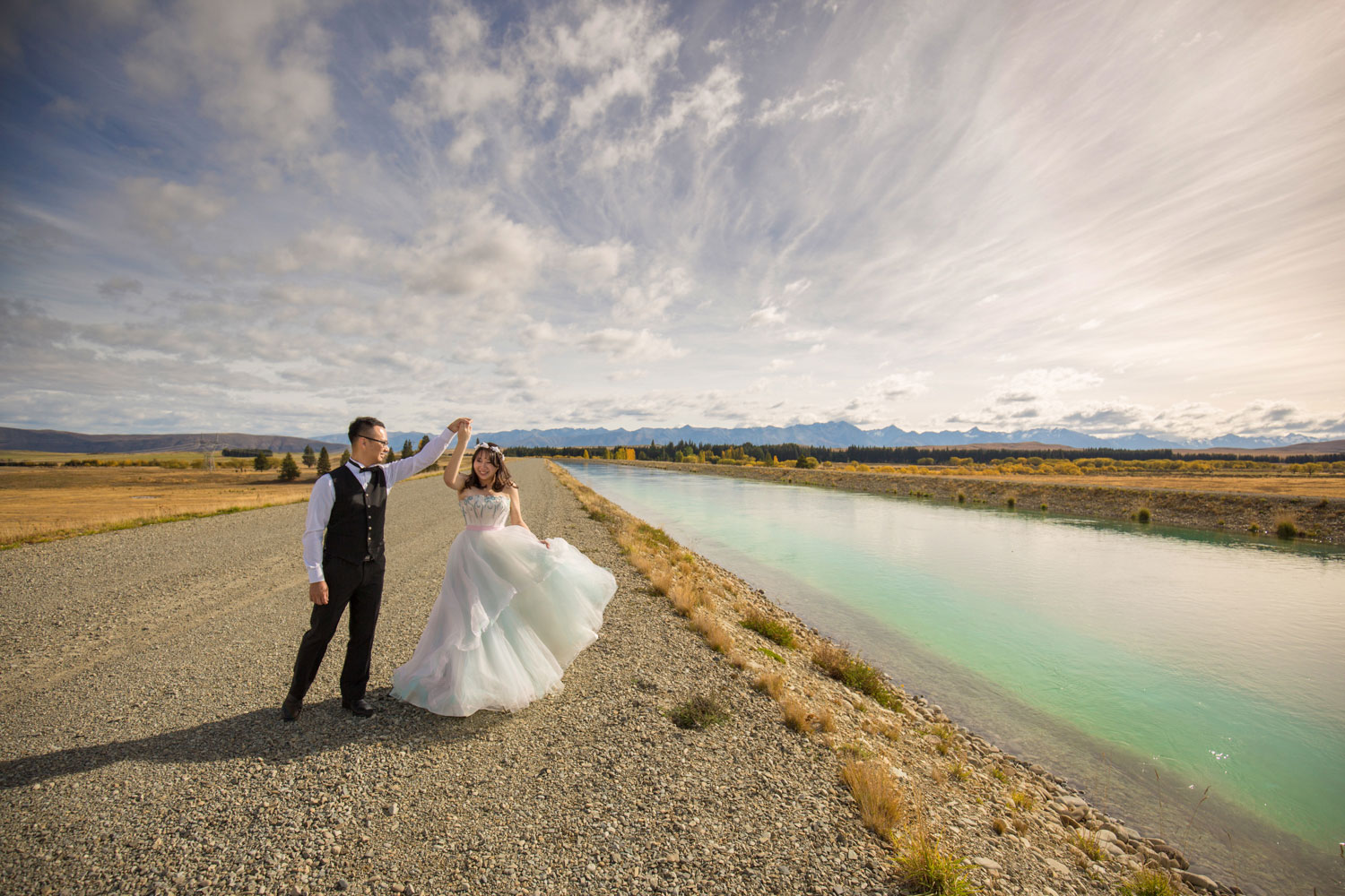 bride twirling lake