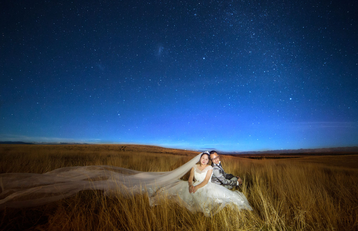 couple sitting under the stars