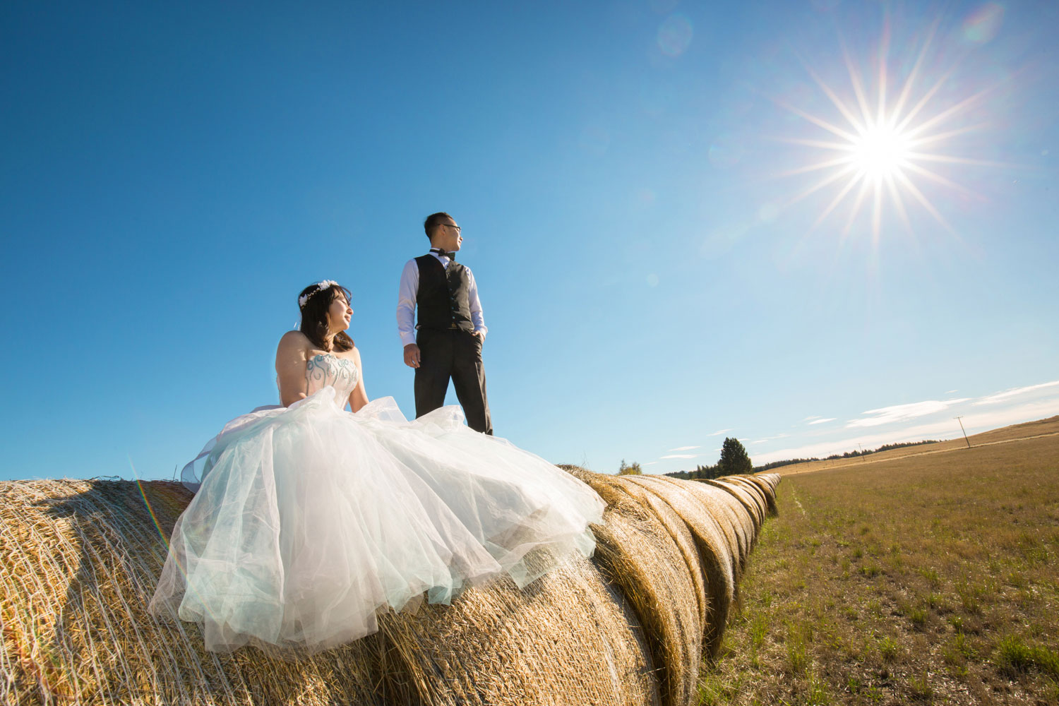 couple hay bale sun