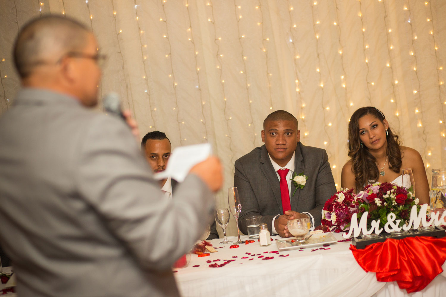 auckland wedding reception couple listening to father's speech