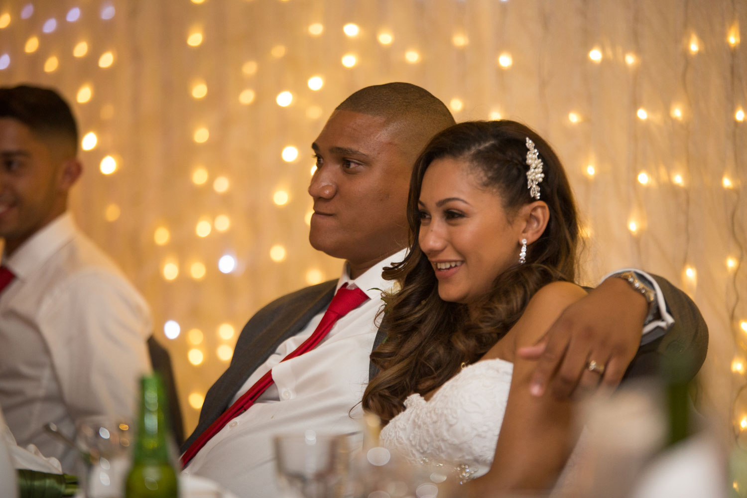 auckland wedding reception couple listening to a speech