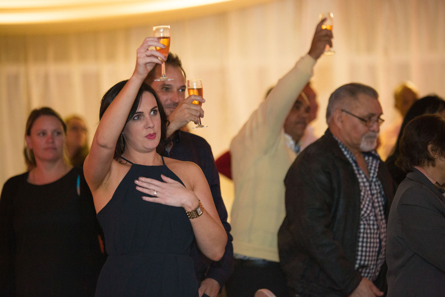 auckland wedding reception guests giving a toast