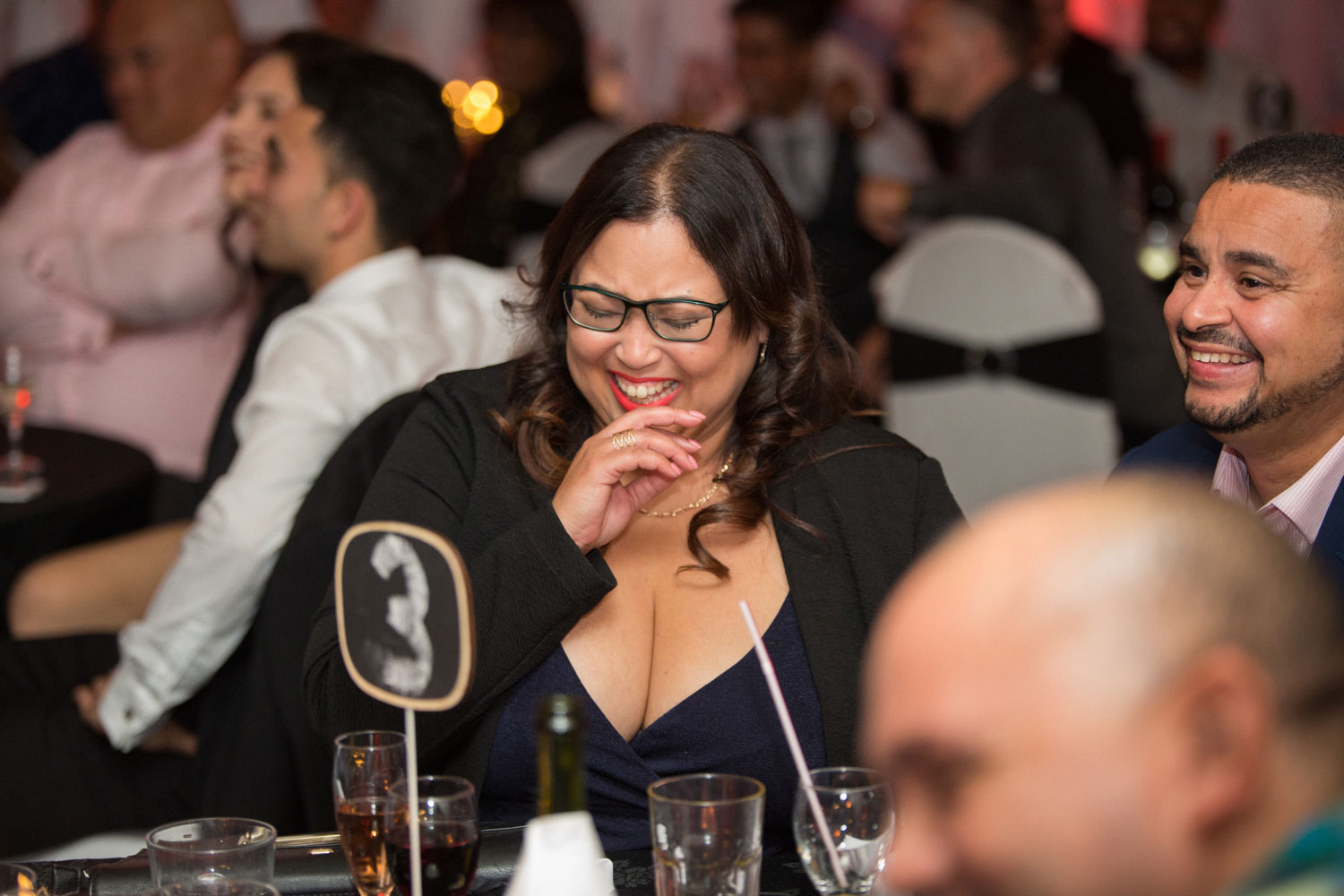 auckland wedding female guest laughing