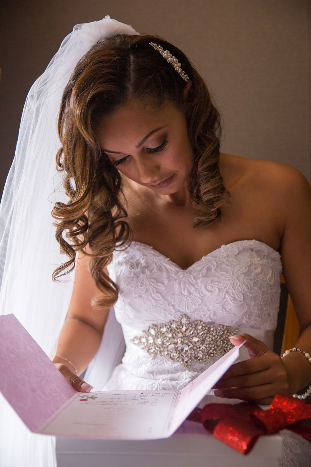 auckland wedding bride looking at gift from groom