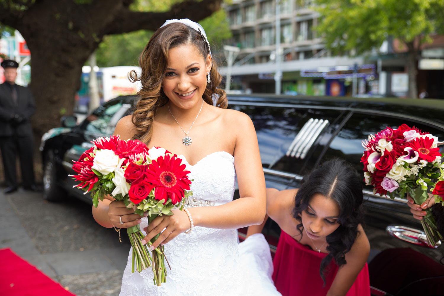 auckland wedding bride smiling outside the limo