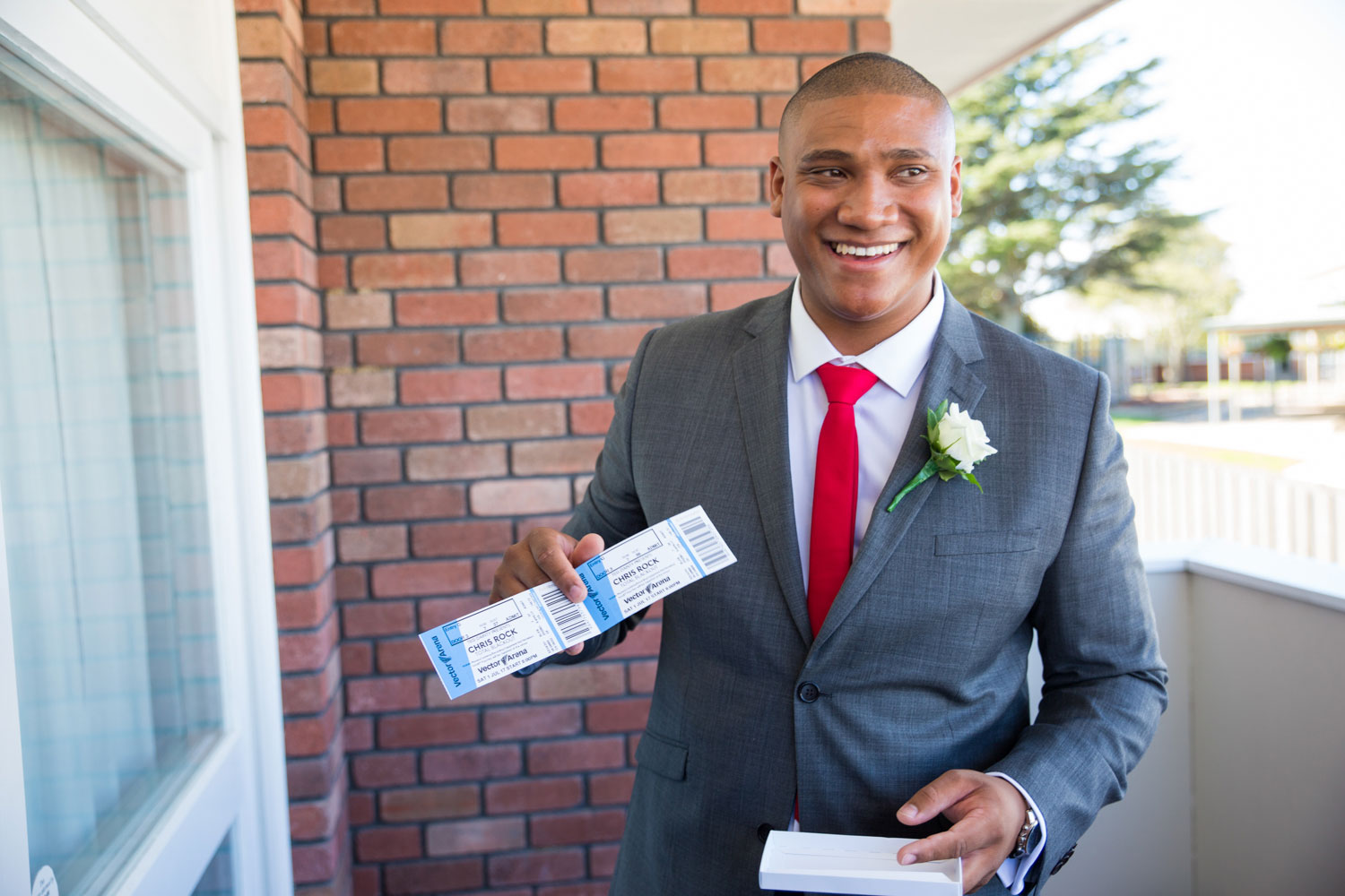 auckland wedding groom receiving a gift from the bride