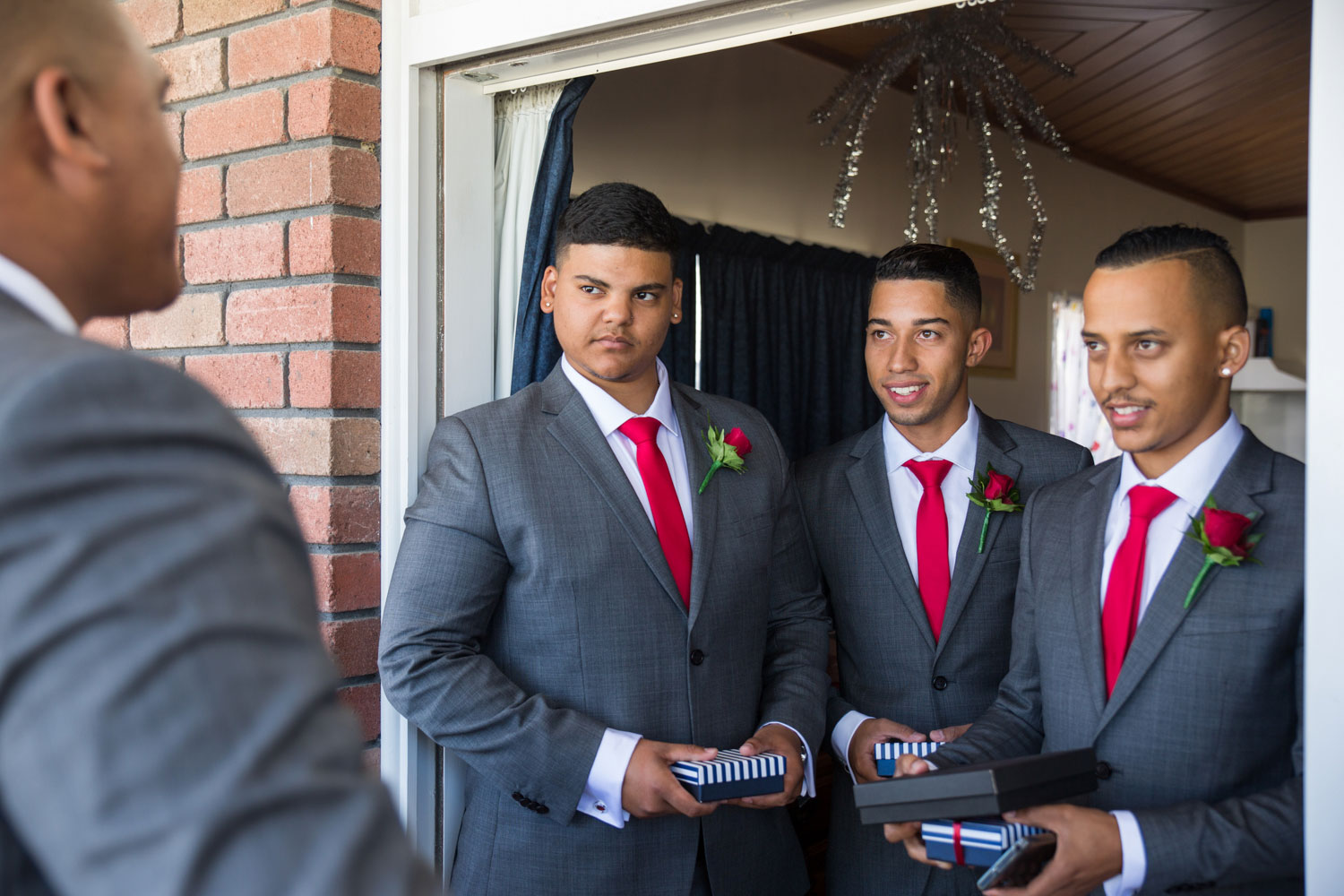 auckland wedding groomsmen receiving gifts