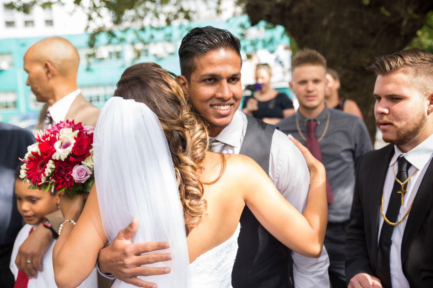 auckland wedding guest hugs bride