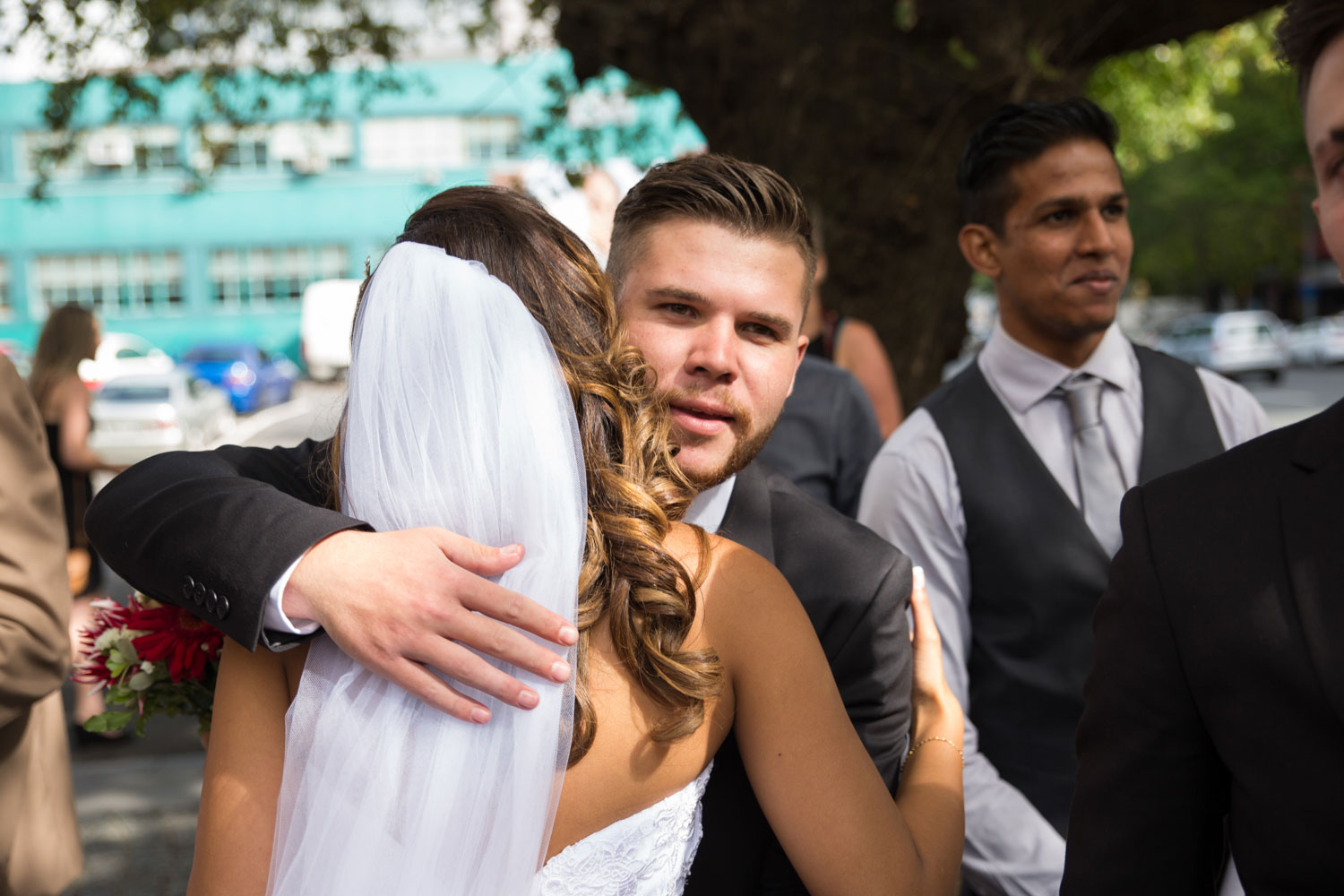 auckland wedding guest hug bride