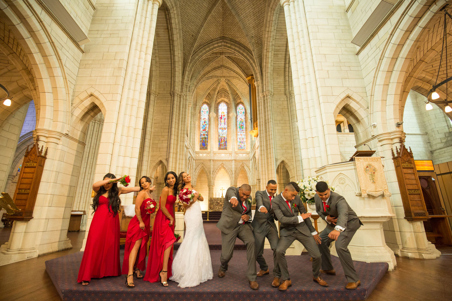 auckland wedding bridal party striking a pose in the church