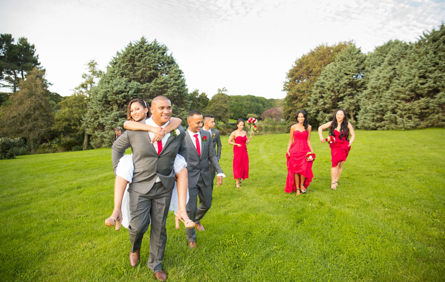 auckland wedding groom and bride piggy back