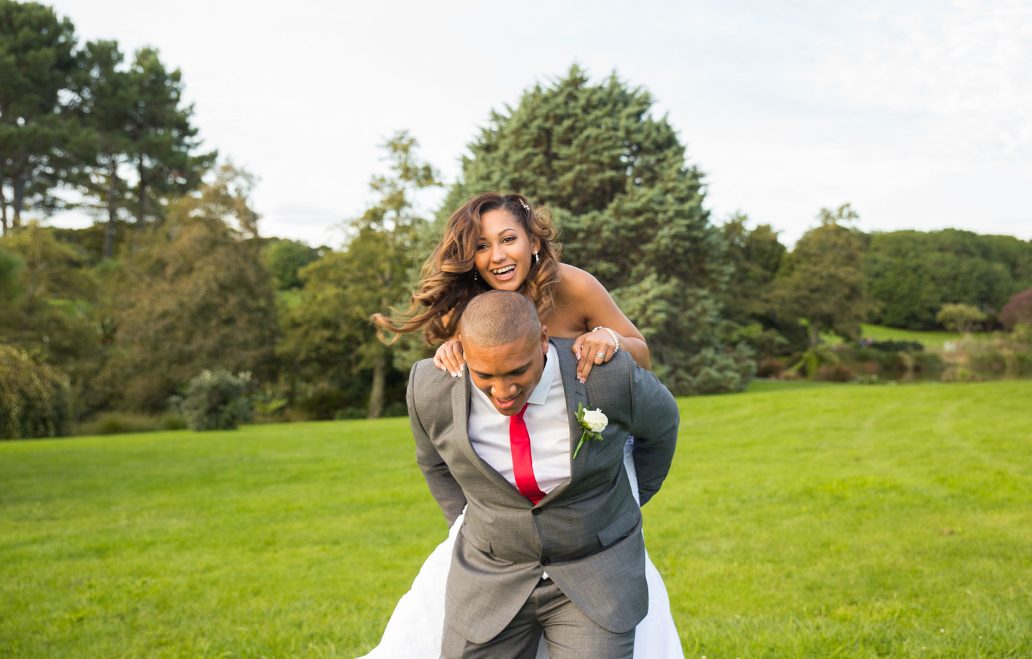 auckland wedding bride jumping on groom's back