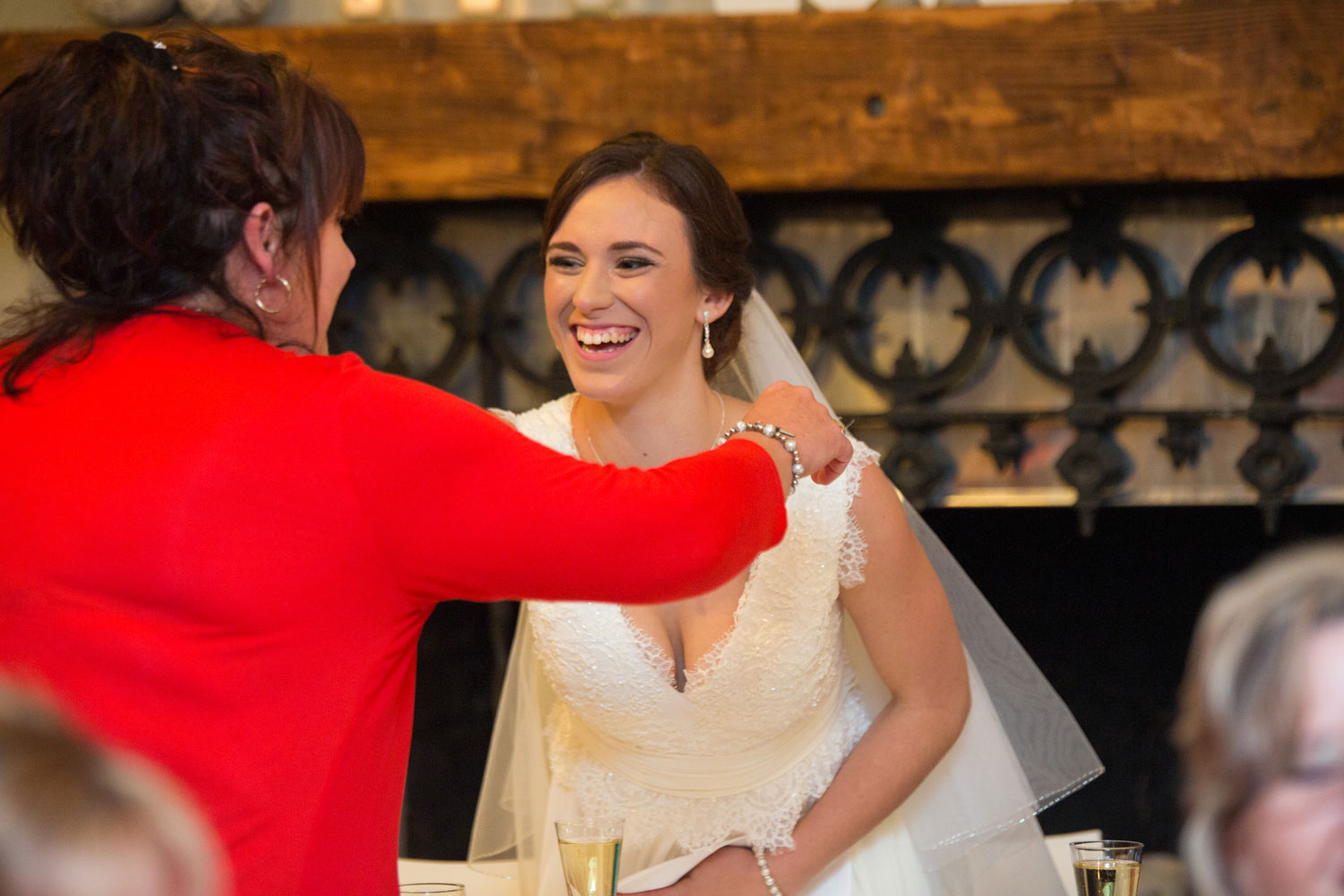 bride embracing a guest at cassels