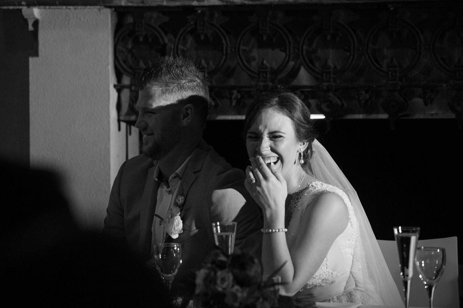 bride and groom having a laugh wedding reception