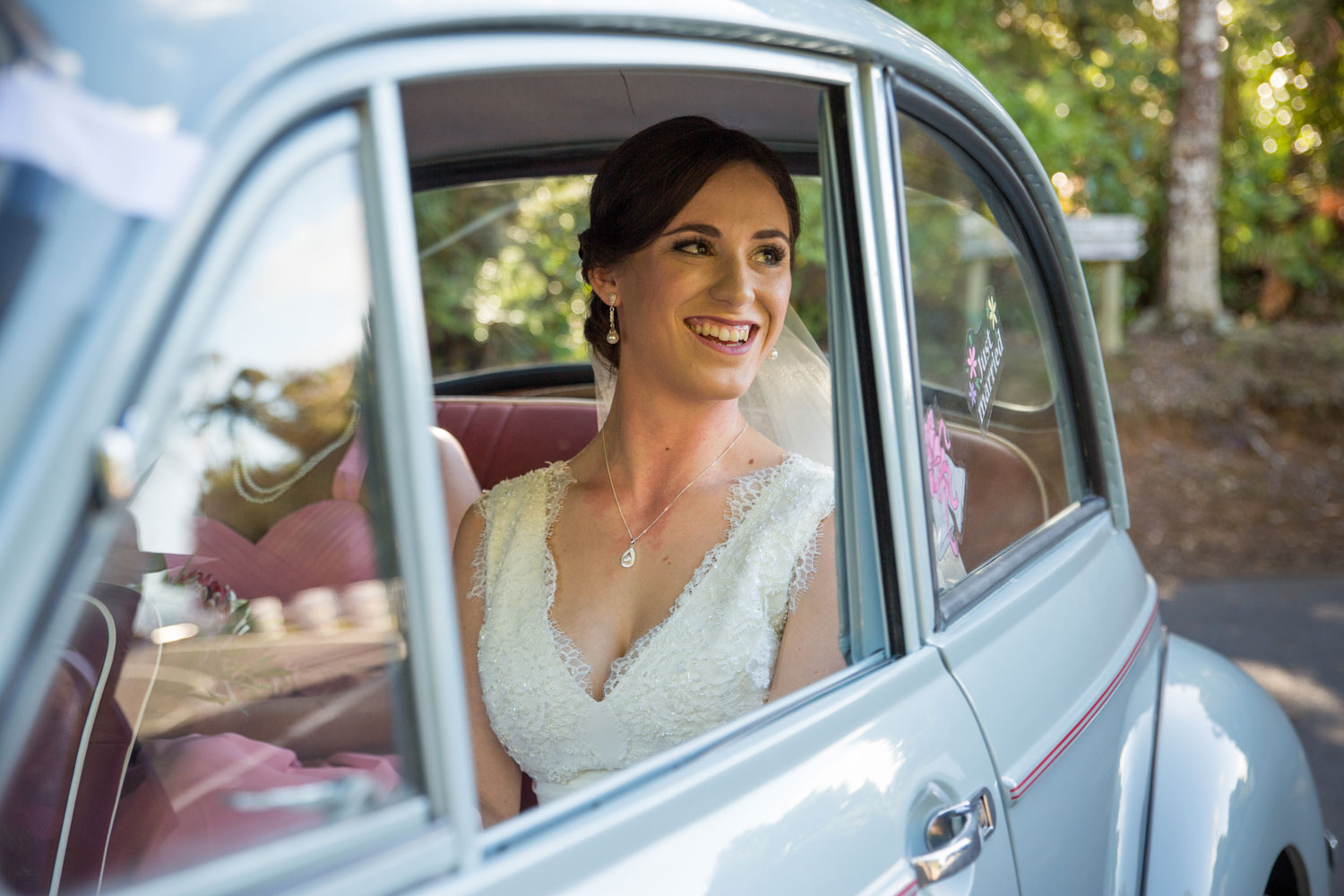 bride in car leaving waitakare estate