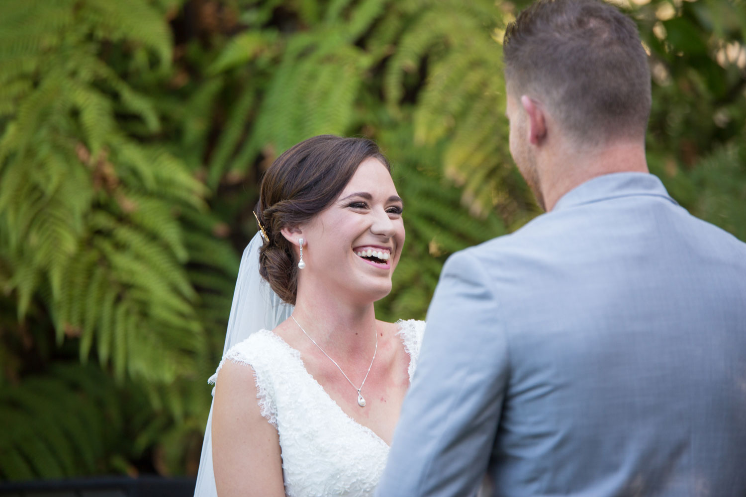 bride smiling during wedding ceremony