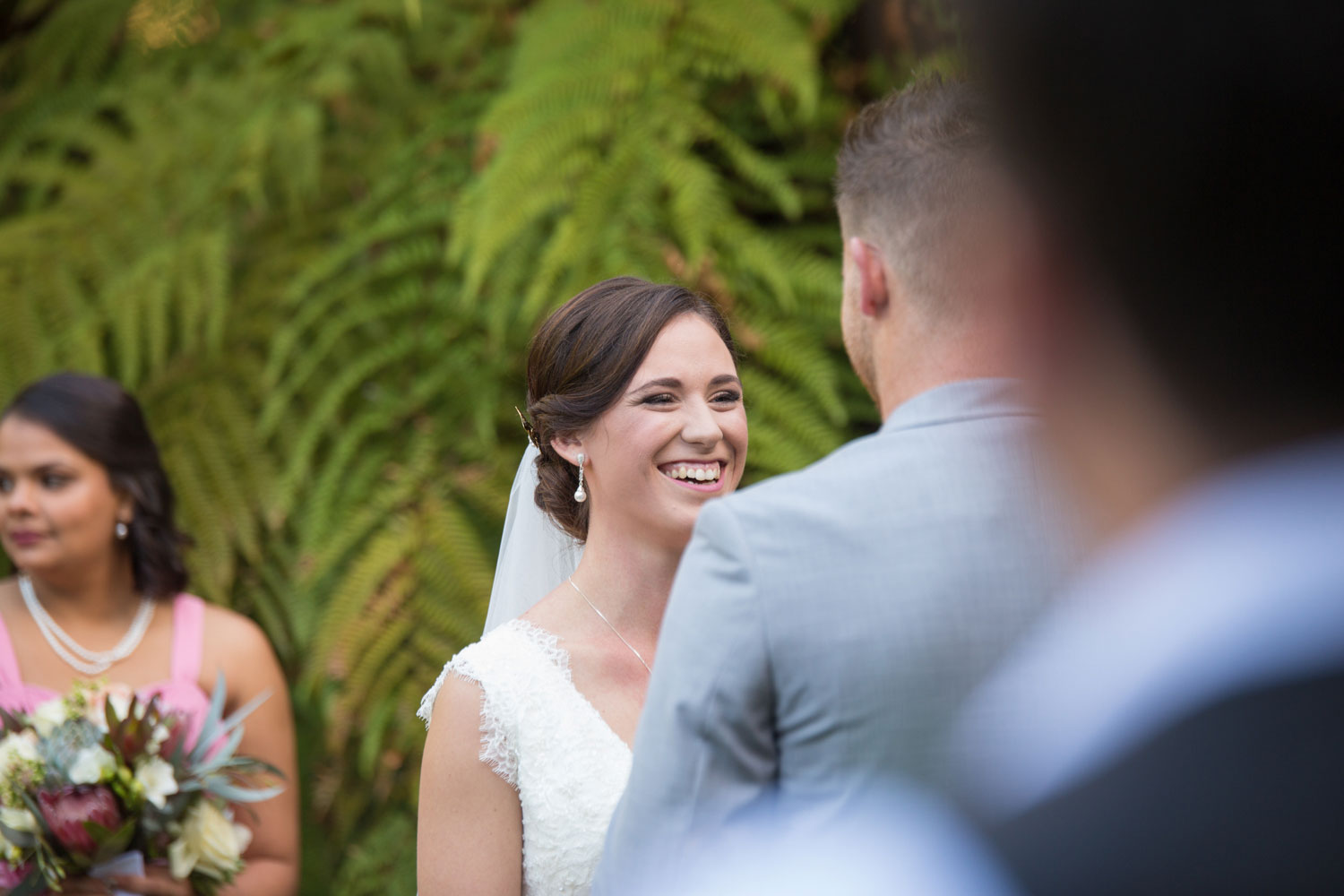 bride laughing at wedding ceremony