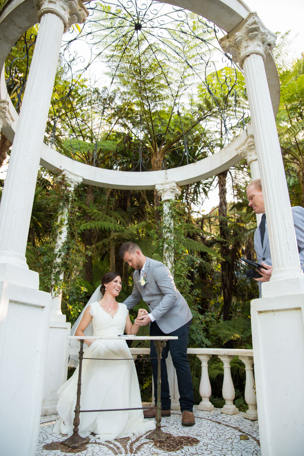 couple signing papers wedding