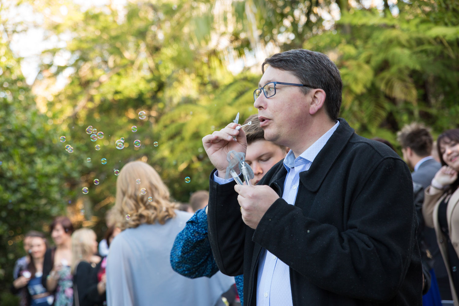 cassels wedding venue guest blowing bubbles