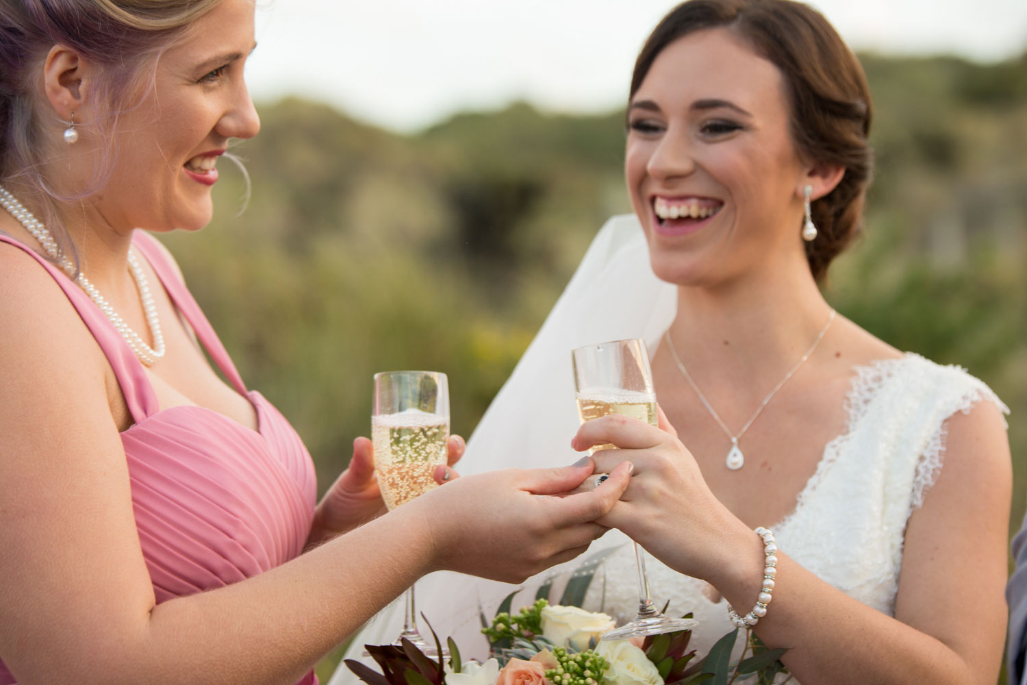 bride and the girls drinking and laughing