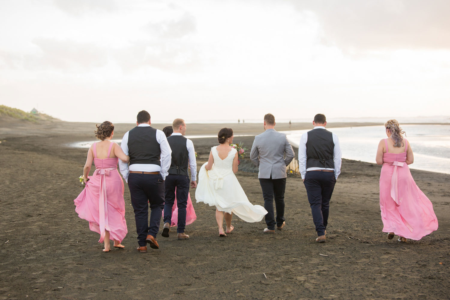 bridal party walking bethells beach