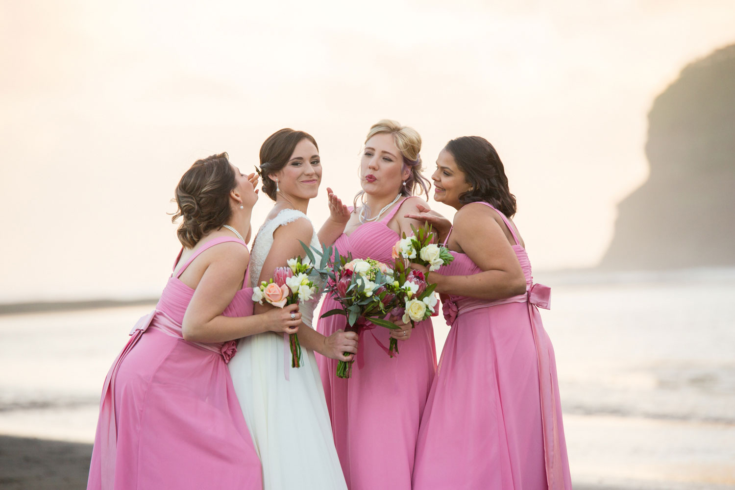 bridesmaids having a good time bethells beach