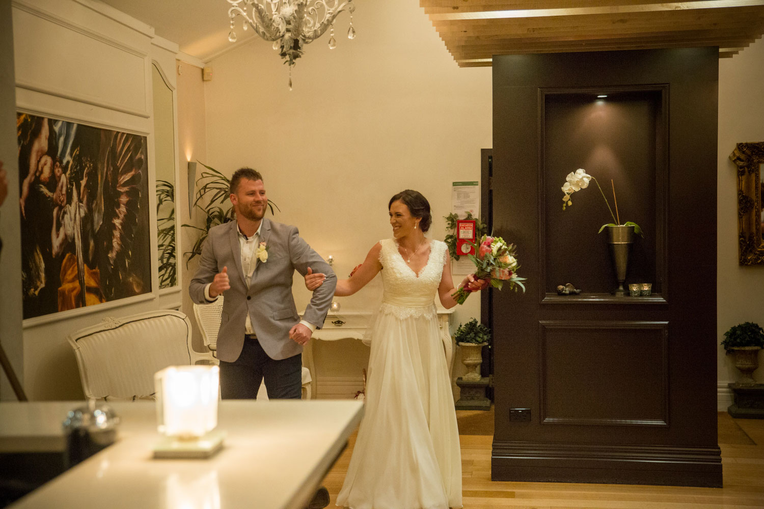 couple walking in cassels reception