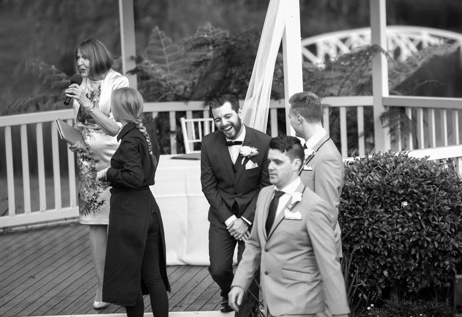 groom laughing with groomsmen gracehill auckland wedding