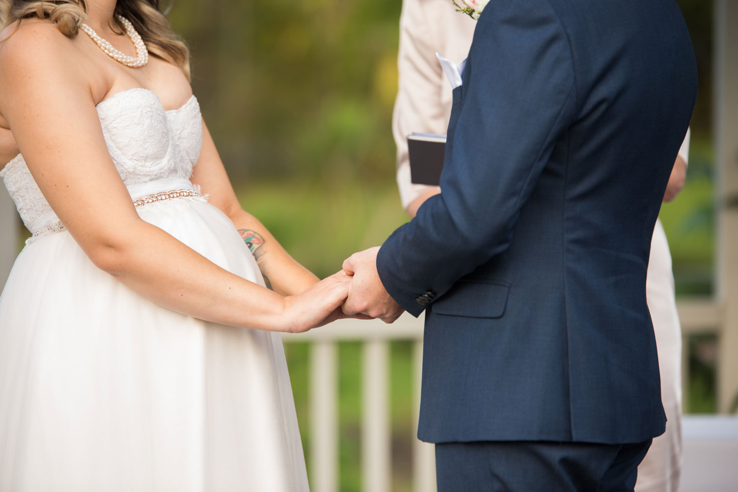 couple holding hands for wedding ceremony