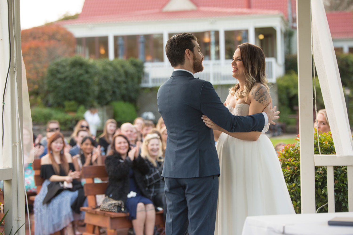 groom holding bride during wedding ceremony