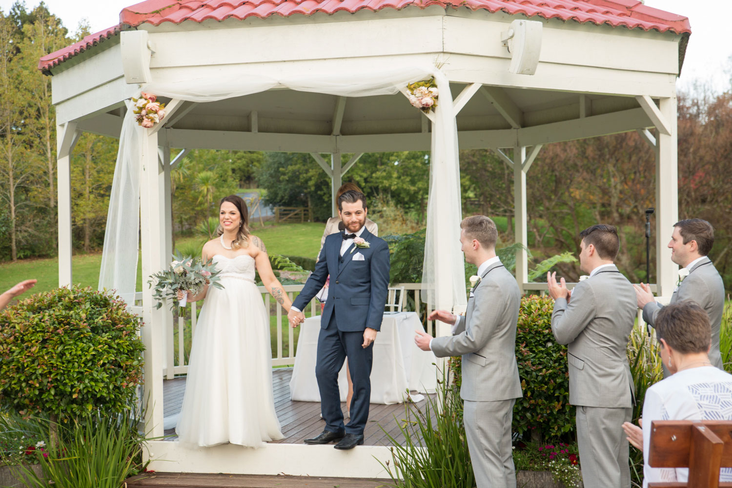 bride and groom finish signing papers