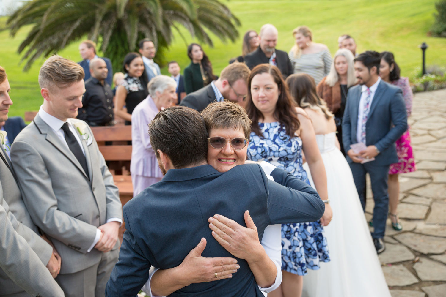 groom hugging mother of bride