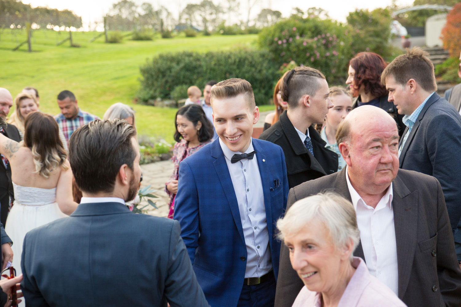 guest congratulating the groom