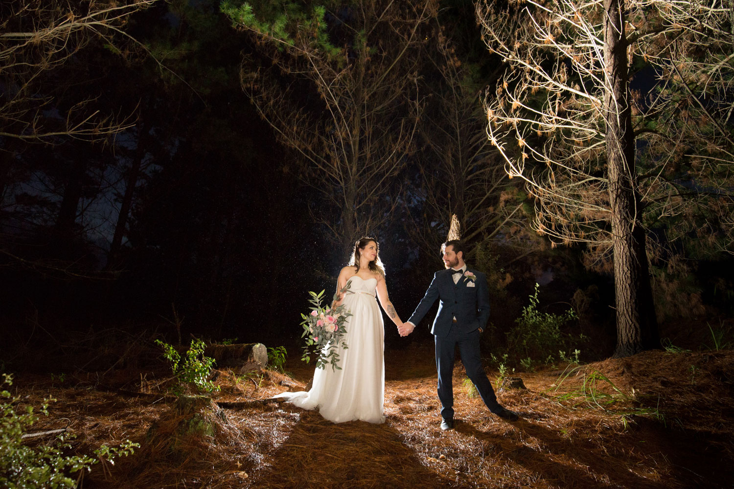 couple posing in riverhead forest auckland wedding