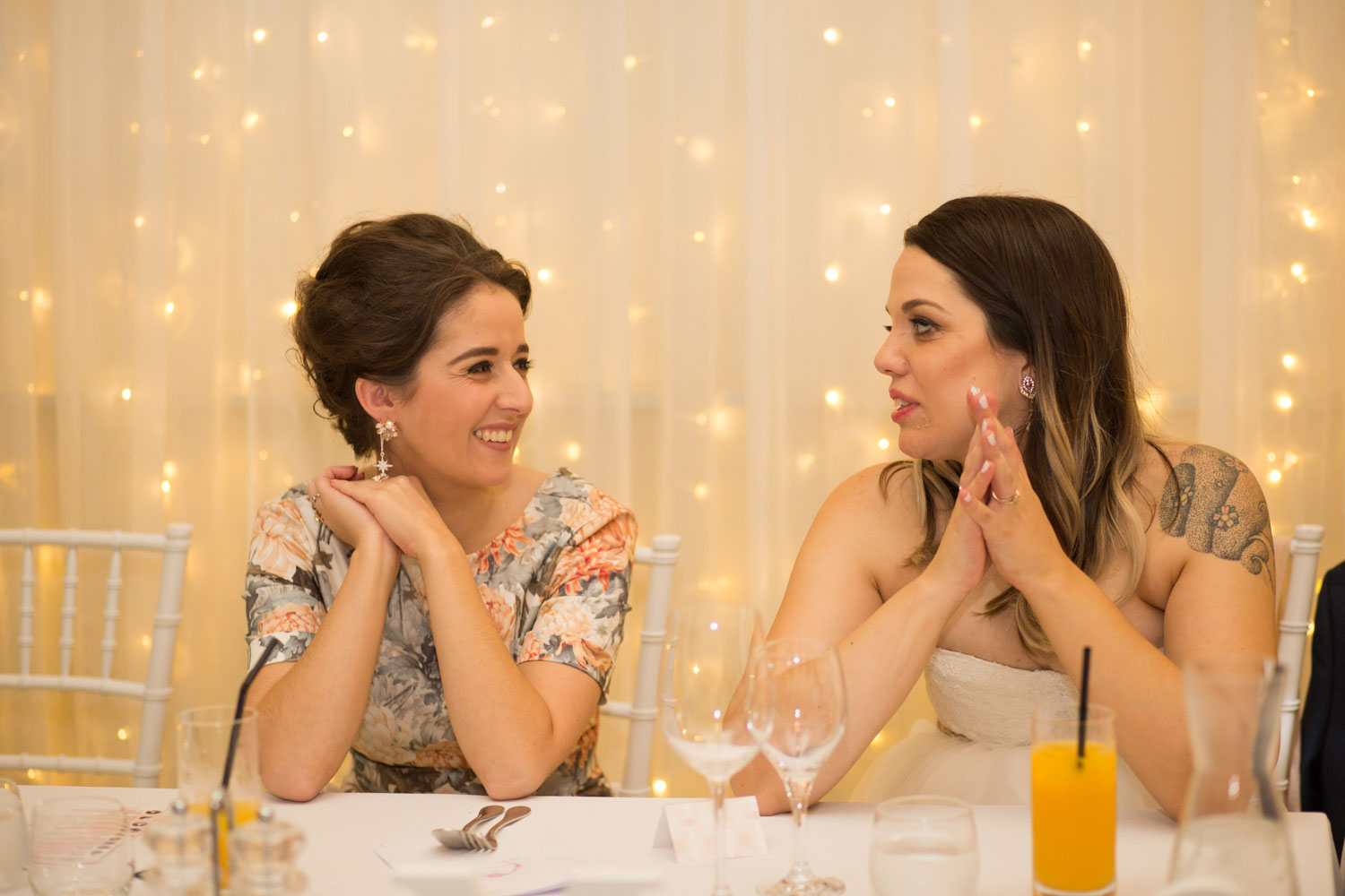 bride and bridesmaid talking