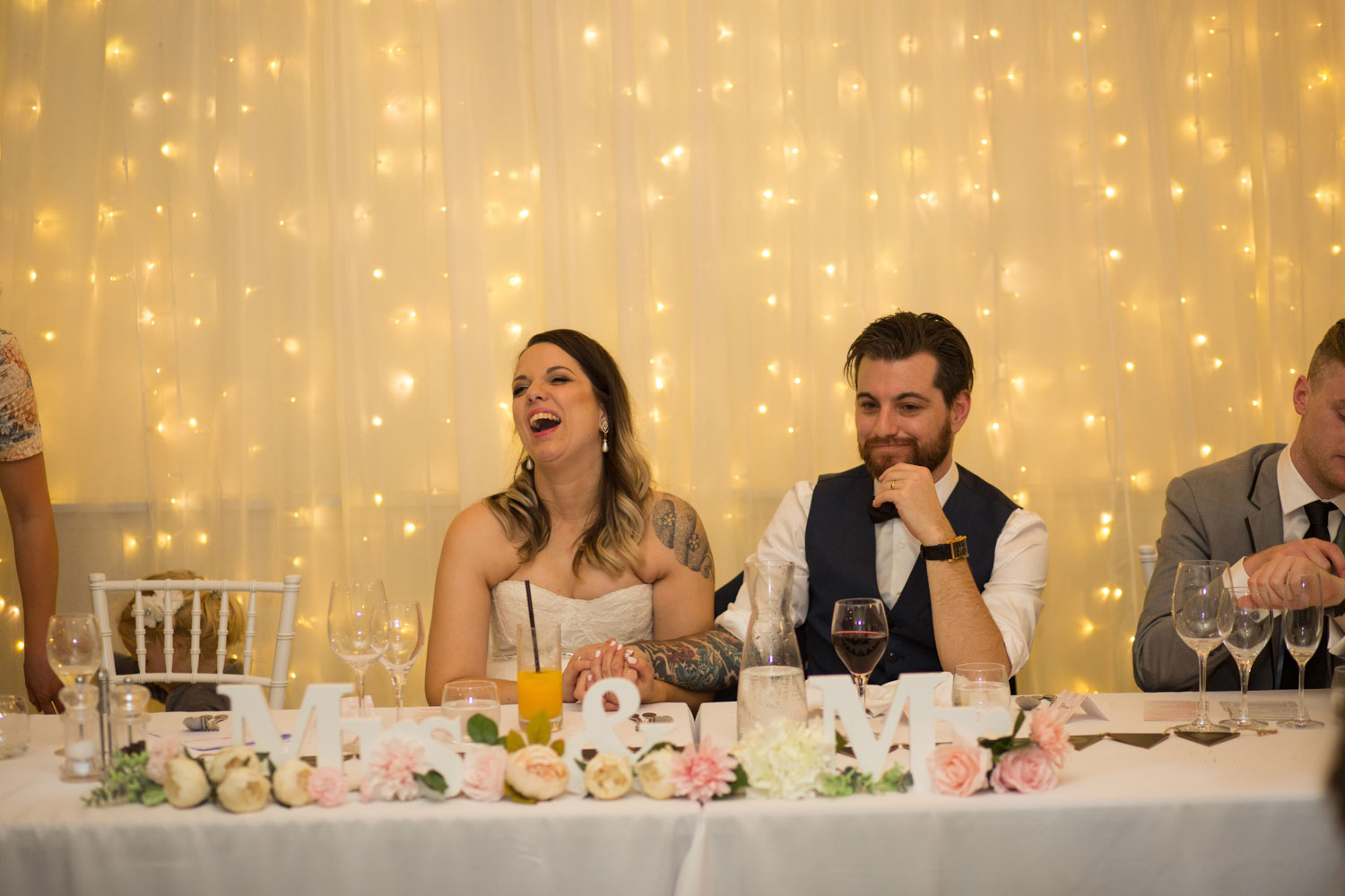bride laughing at reception