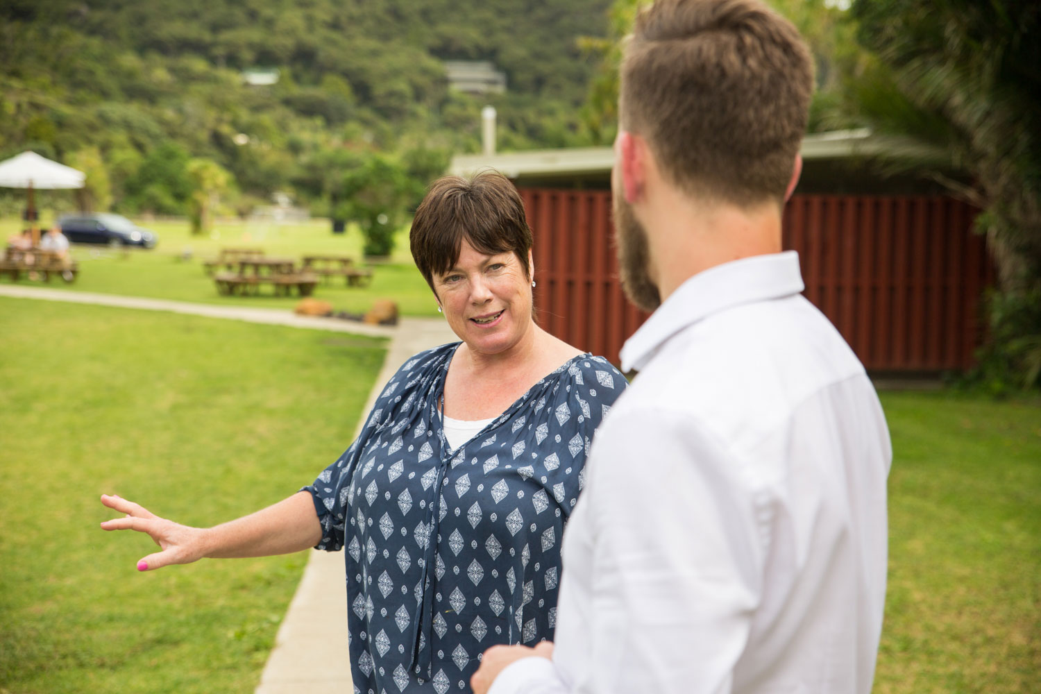 auckland wedding piha mill camp guest talking