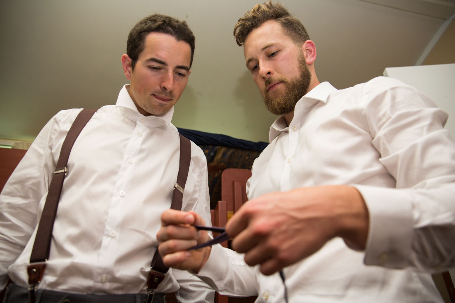 auckland wedding groomsmen thinking