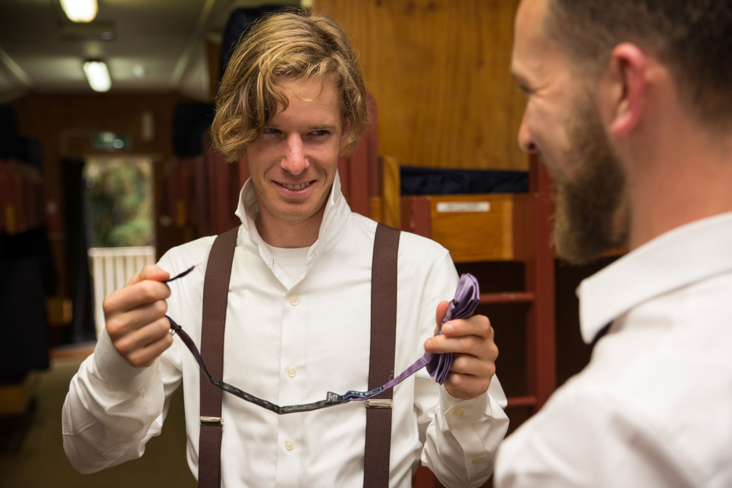 auckland wedding groomsman looking at groom